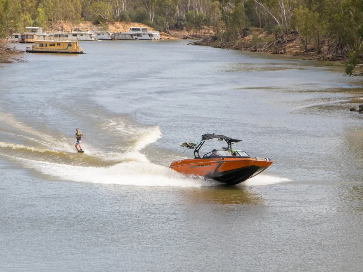 Wakeboarding behind a boat on the Murray River at Echuca
